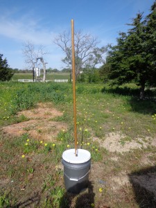 Long Pole Attached to Rapid Washer in a Bucket
